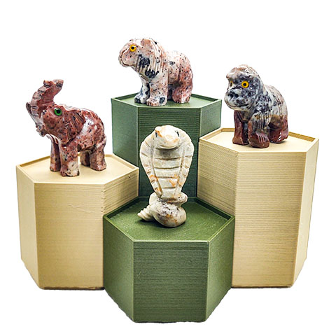 A view of the 'Wild and Exotic' kit. Includes tan and olive green stands, a cobra, gorilla, elephant and lion.